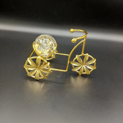 Metal cycle holding Glass Ball