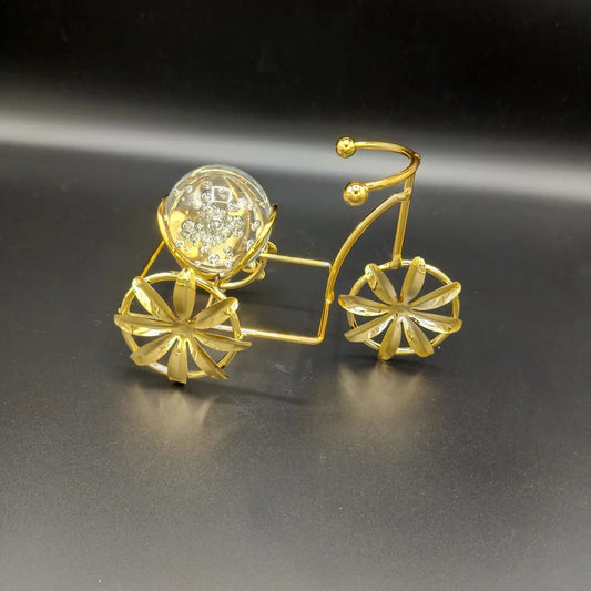 Metal cycle holding Glass Ball